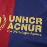 Barcelona x Coldplay (Special Release) Fan Version jersey featuring the UNHCR ACNUR logo on red and blue fabric.