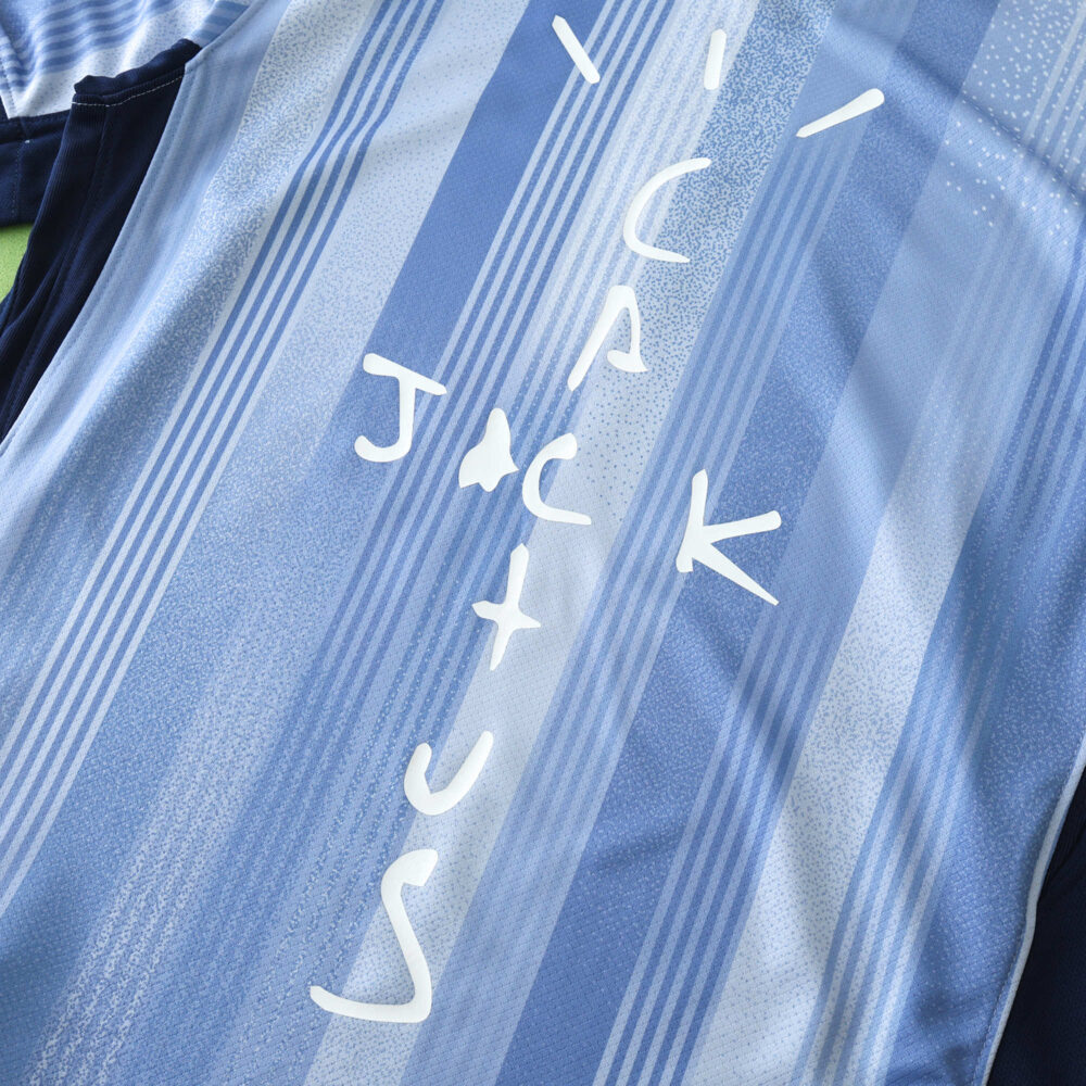Tottenham x Travis Scott special release fan jersey featuring "JACK CACTUS" text on a blue striped background.