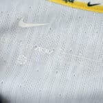 Close-up view of the Tottenham x Travis Scott Player Version jersey, featuring Nike logo and detailed fabric texture.