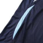 Close-up view of the Argentina Retro Away 2006 Fan Version jersey, showing a part of its navy blue fabric and light blue details.