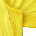 Close-up view of the yellow fabric and mesh details on the Arsenal Retro Away | 2003/04 | Fan Version jersey.