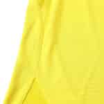 Close-up of the yellow Arsenal Retro Away shirt from the 2003/04 season, showcasing fabric texture and stitching detail.