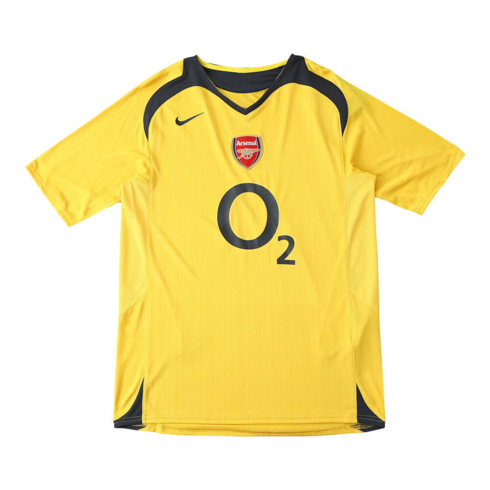 Arsenal Retro Away 2005/06 Fan Version Jersey. Yellow with navy accents, Nike logo, Arsenal crest, and O2 sponsor on the front.