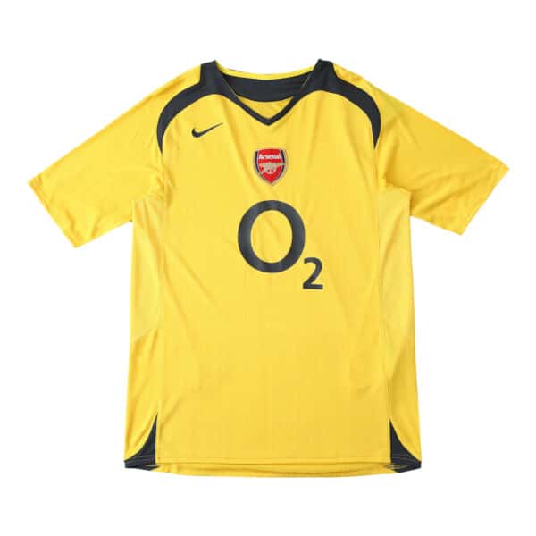 Arsenal Retro Away 2005/06 Fan Version Jersey. Yellow with navy accents, Nike logo, Arsenal crest, and O2 sponsor on the front.