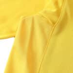 Close-up view of Arsenal Retro Away 2005/06 fan version jersey, showcasing yellow fabric detail and texture.