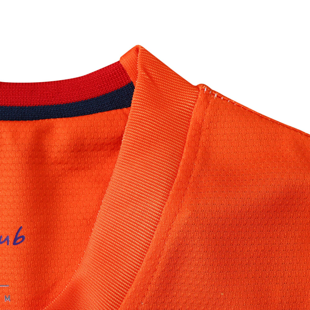 Close-up view of the Barcelona Retro Away 2012/13 fan version shirt's collar, featuring orange fabric and red-blue details.