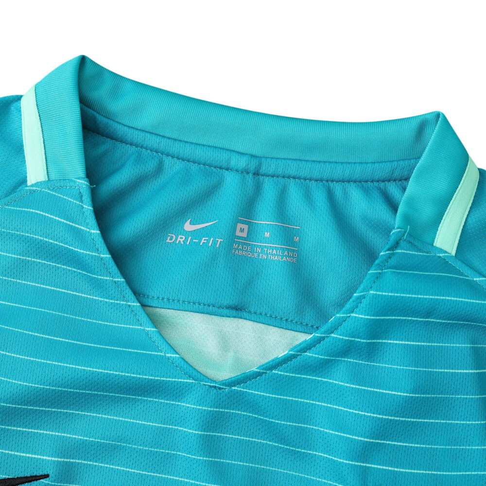 Close-up of the collar and tag area of Barcelona's 2016/17 Retro Third Fan Version jersey in teal with subtle stripes.