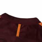Close-up of the collar on Barcelona Retro Third | 2017/18 Fan Version, showcasing maroon fabric and orange details.