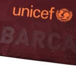 Close-up of the 2017/18 Barcelona Retro Third jersey displaying the UNICEF logo in orange text above "BARCA".
