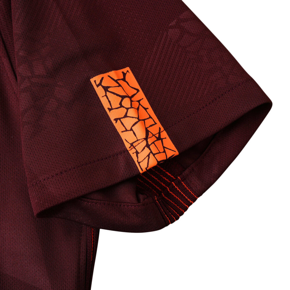 Close-up of the sleeve detail on the Barcelona Retro Third 2017/18 Fan Version jersey, showcasing an orange pattern.