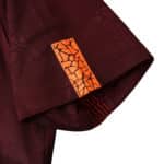 Close-up of the sleeve detail on the Barcelona Retro Third 2017/18 Fan Version jersey, showcasing an orange pattern.