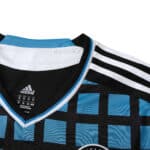 Close-up of the Chelsea Retro Third 2011/12 Fan Version jersey highlighting its black, blue checkered design with the Adidas logo.