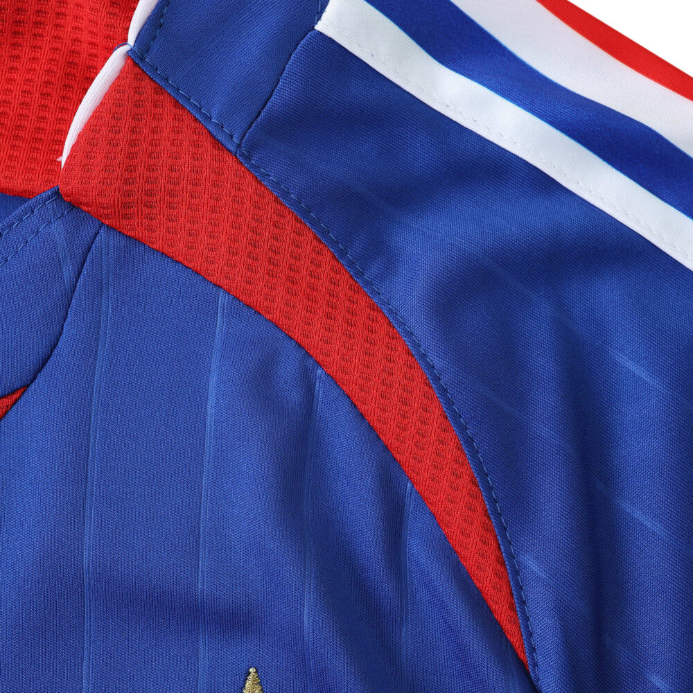 Close-up view of the France Retro Home 2006 Fan Version jersey, highlighting the fabric and blue, red, and white color details.
