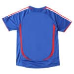 Back view of the France Retro Home 2006 Fan Version jersey, featuring blue fabric with red and white accents.