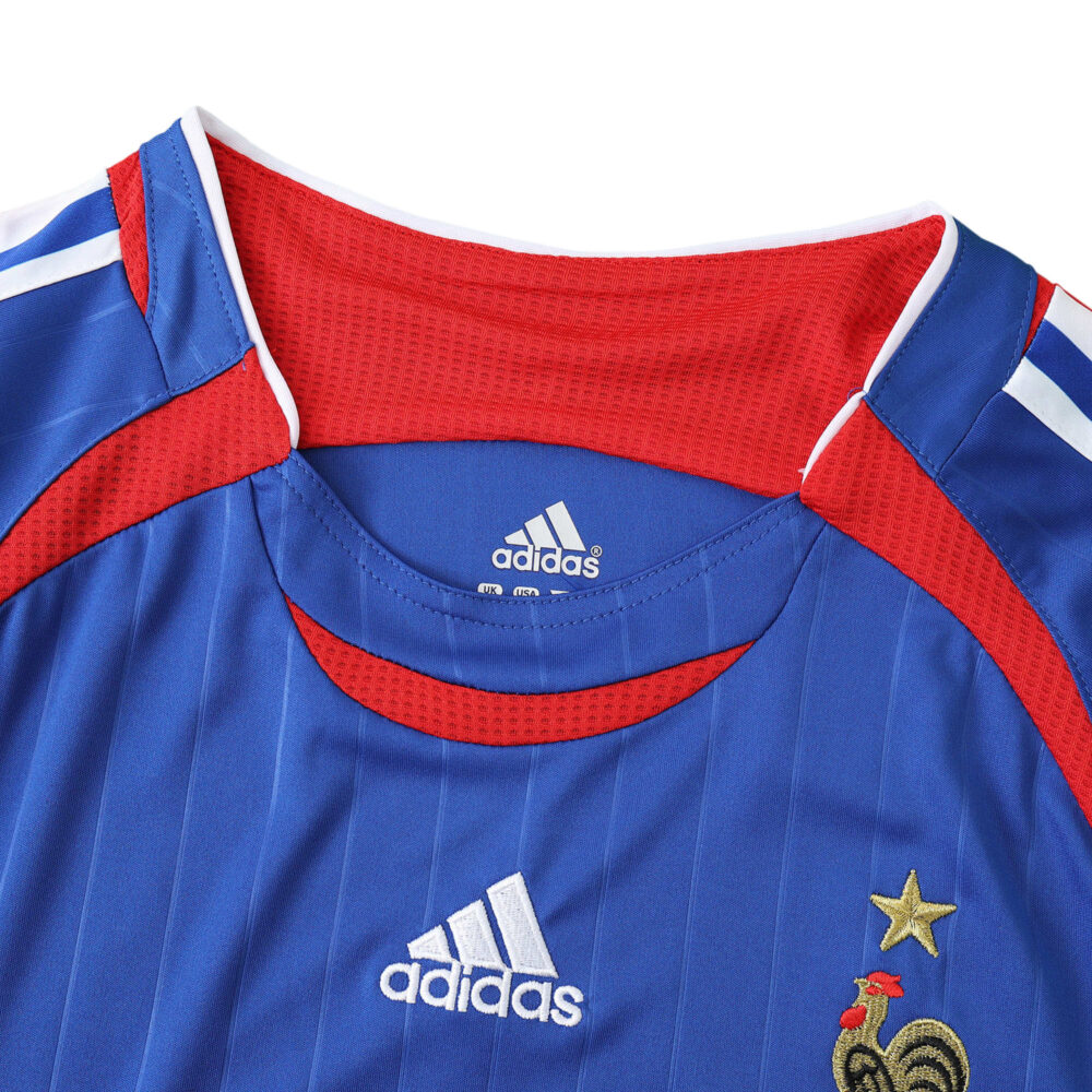 France Retro Home 2006 fan version jersey, featuring blue and red design with Adidas logo and embroidered national crest.
