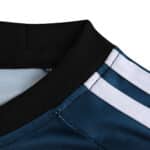 Close-up of the Germany Retro Goalkeeper jersey's collar and shoulder from the 2002 fan version, showcasing black trim and white stripes.
