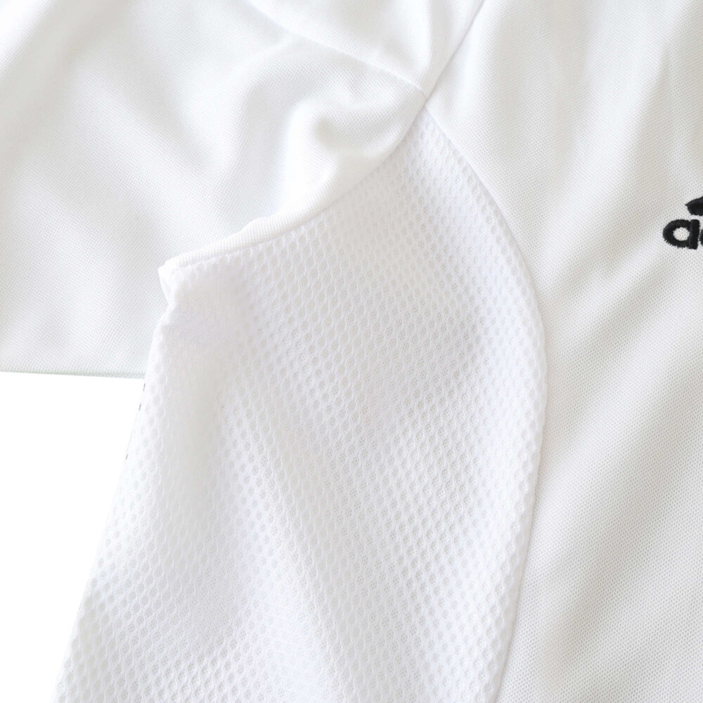 Close-up of the Germany Retro Home 2002 Fan Version jersey showing fabric texture and part of logo.