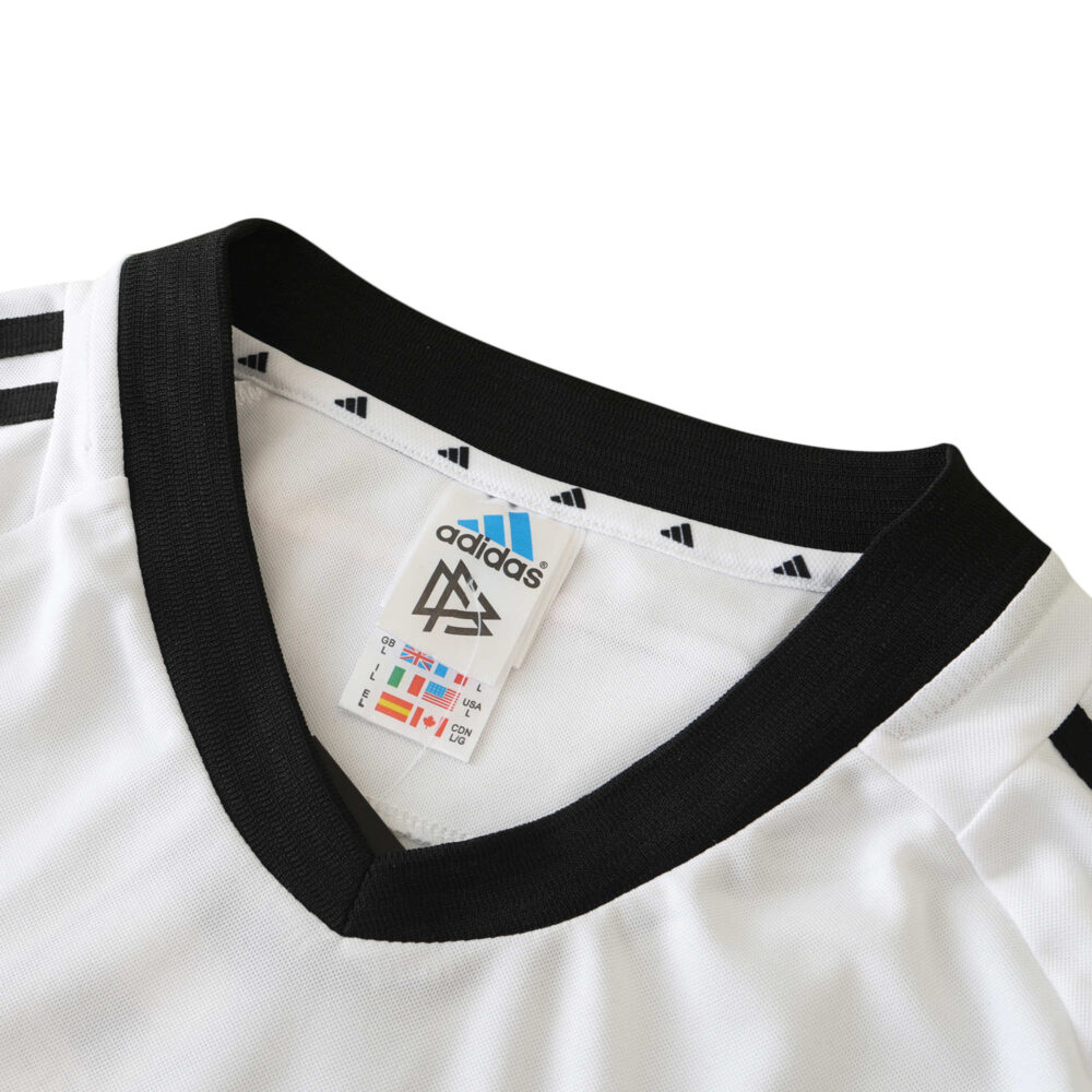 Germany Retro Home 2002 Fan Version soccer jersey with Adidas and DFB logos on collar. Black V-neck and shoulder stripes.