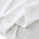 Close-up view of fabric used in the Germany Retro Home | 2002 | Fan Version jersey, highlighting material and stitching.
