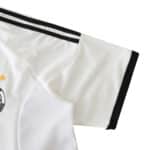 Close-up of the sleeve on the Germany Retro Home 2002 Fan Version jersey, showing black and white stripes and fabric texture.