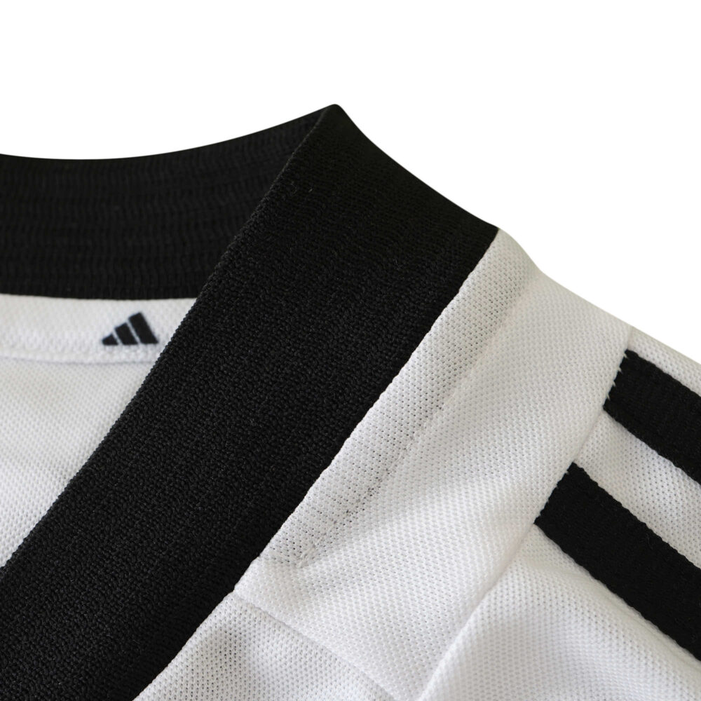 Close-up of Germany Retro Home 2002 Fan Version jersey showing black collar and shoulder stripes.