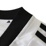Close-up of Germany Retro Home 2002 Fan Version jersey showing black collar and shoulder stripes.