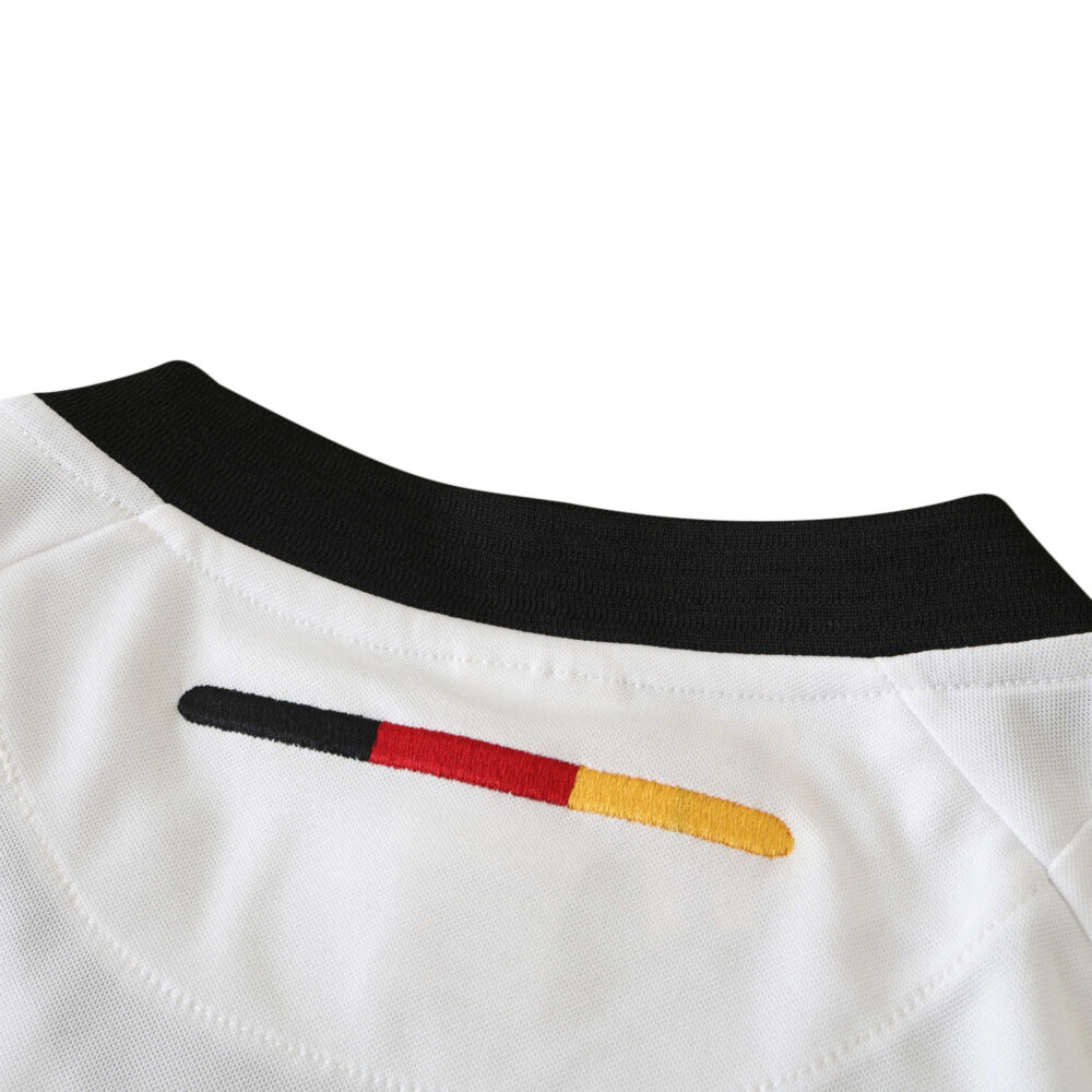 Close-up of the back collar detail of Germany Retro Home | 2002 Fan Version, showing the German flag colors embroidered.