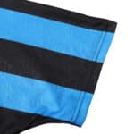 Close-up of the sleeve of an Inter Milan Retro Home 1992/93 jersey, showing blue and black horizontal stripes.