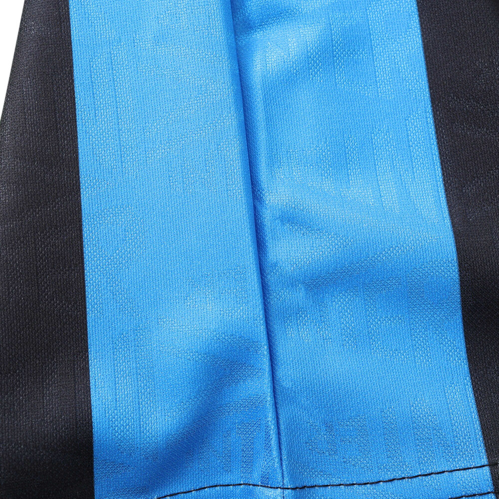 Close-up detail of the Inter Milan Retro Home 1992/93 jersey, showcasing blue and black fabric stripes.