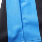 Close-up detail of the Inter Milan Retro Home 1992/93 jersey, showcasing blue and black fabric stripes.