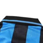 Close-up of the collar on the Inter Milan Retro Home 1992/93 fan version jersey, featuring black and blue stripes.