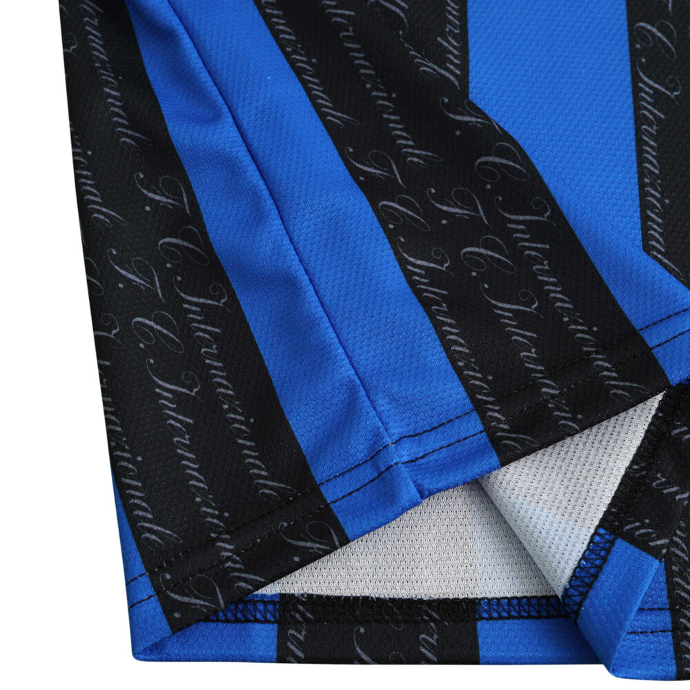 Close-up of the sleeve of Inter Milan Retro Home 1997/98 Fan Version jersey showing blue and black stripes with text detailing.