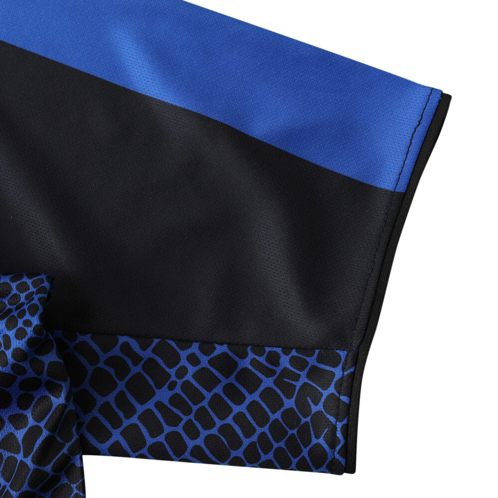 Close-up of the sleeve from Inter Milan Retro Home | 2001/02 | Fan Version jersey showcasing blue and black fabric with pattern detail.