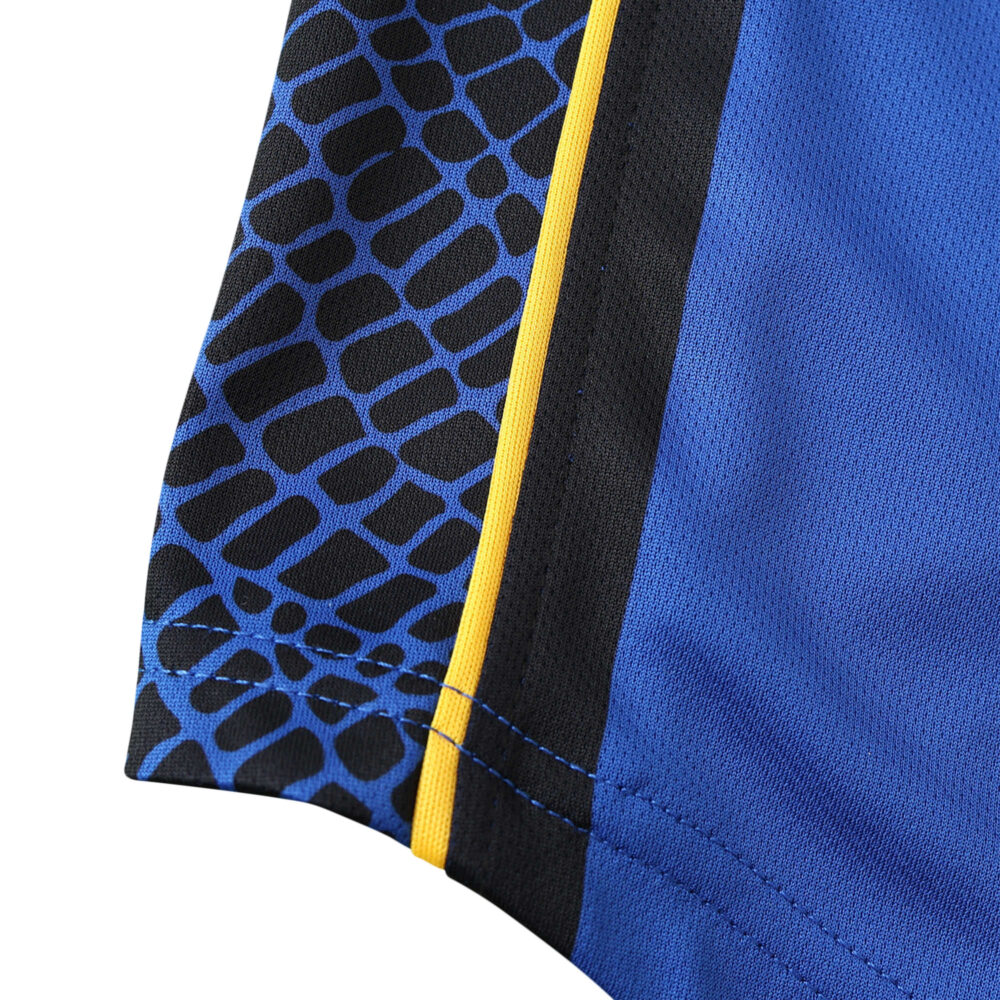 Close-up of the Inter Milan Retro Home 2001/02 jersey fabric showing blue and black patterns with a yellow stripe detail.