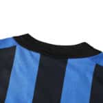 Close-up of the collar and black and blue vertical stripes on the Inter Milan Retro Home 2002/03 Fan Version jersey.