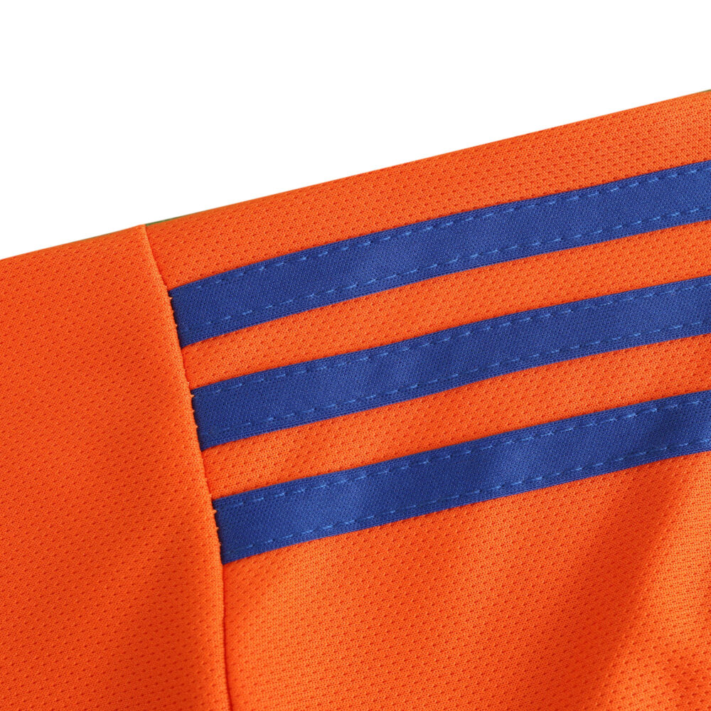 Close-up of the Italy Goalkeeper 2024 Fan Version jersey, featuring orange fabric with blue stripes on the shoulder.