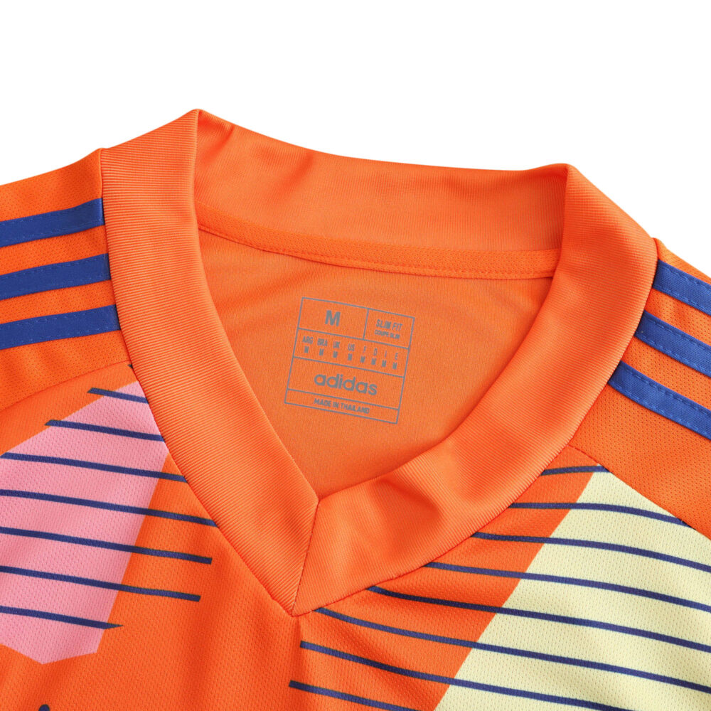 Front view of the Italy Goalkeeper 2024 Fan Version jersey showcasing its vibrant orange collar and colorful design details.