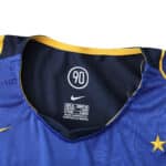 Close-up of the Juventus Retro Away 2004/05 Fan Version collar, showing Nike logo and size details.