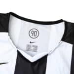 Close-up of the collar and tag inside a Juventus Retro Home 2004/05 Fan Version jersey. Nike logo visible above the shirt size.