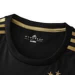Close-up of the Juventus Retro Third 2015/16 Fan Version jersey neckline, featuring gold accents and adidas logo inside the collar.