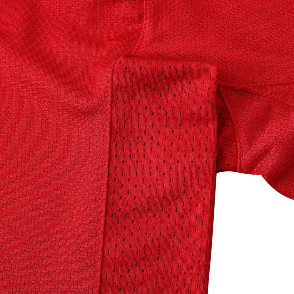 Close-up view of the Manchester United Retro Home 2004/05 Fan Version jersey, showcasing the red fabric and details.
