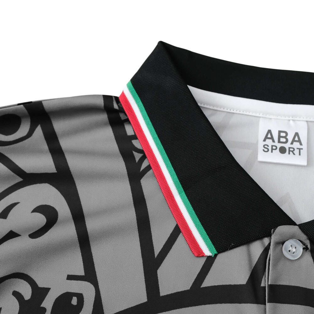 Close-up of Mexico Retro Away 1998 fan version jersey, highlighting the ABA Sport label and black collar with red, white, and green stripes.