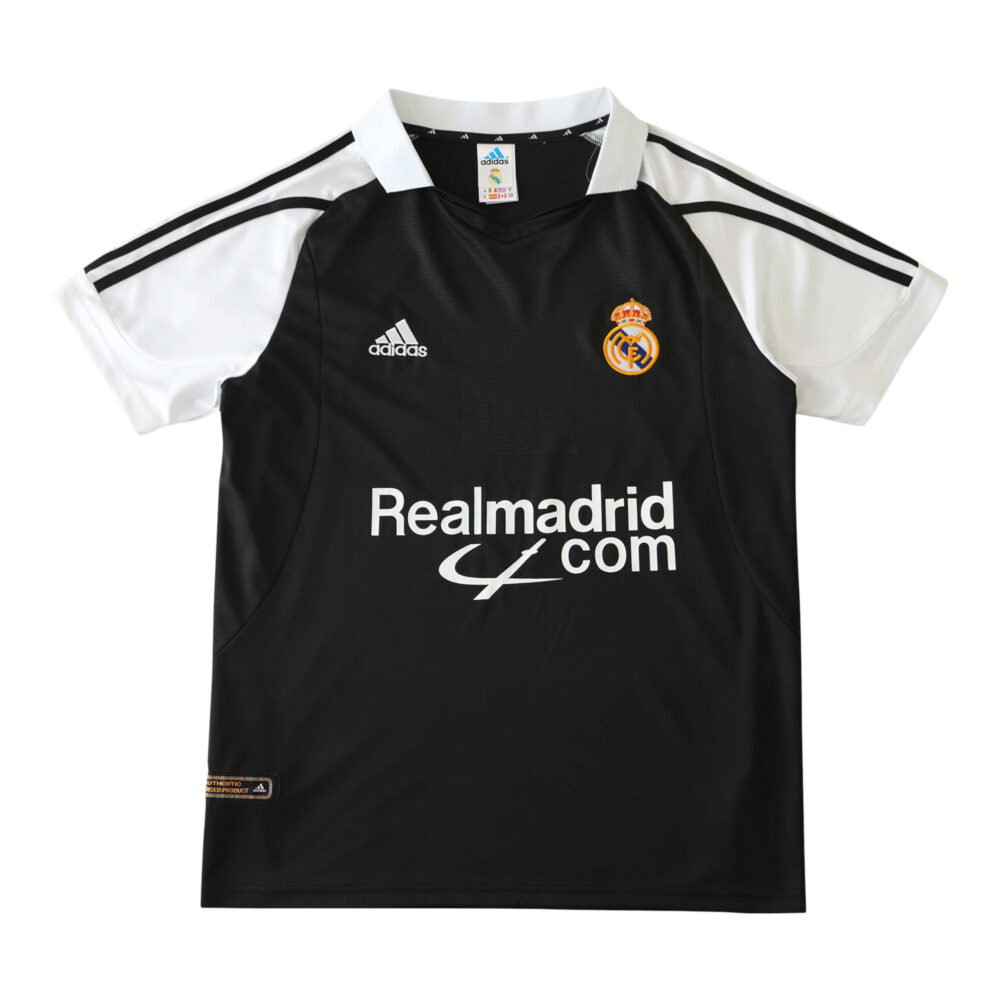 Real Madrid Retro Away fan jersey from the 2001/02 season in black with white accents, featuring Adidas and club logo.