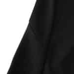 Close-up of the Real Madrid Retro Away fan jersey from 2001/02, showcasing black fabric and stitching details.