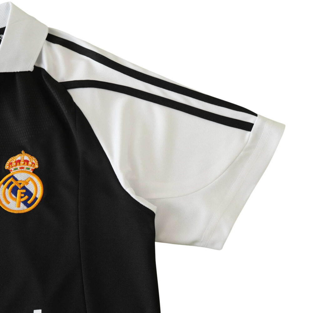 Close-up of the sleeve and shoulder area of the Real Madrid Retro Away fan version jersey from the 2001/02 season.