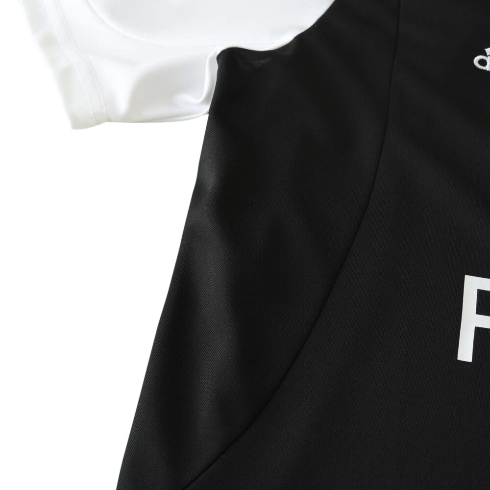 Close-up of the Real Madrid Retro Away fan version jersey from 2001/02, showing the black and white fabric detail.