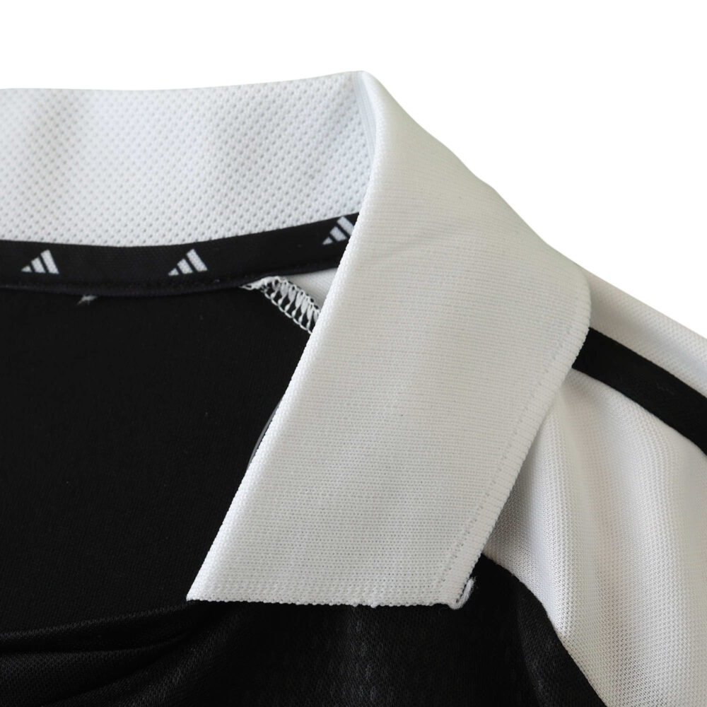 Close-up of the collar on the Real Madrid Retro Away Fan Version Jersey, 2001/02 season. Black with white highlights.