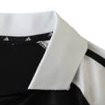 Close-up of the collar on the Real Madrid Retro Away Fan Version Jersey, 2001/02 season. Black with white highlights.