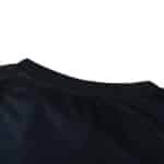 Close-up of the collar and shoulder area of the Real Madrid Retro Away jersey, 2003/04 Fan Version, in black.
