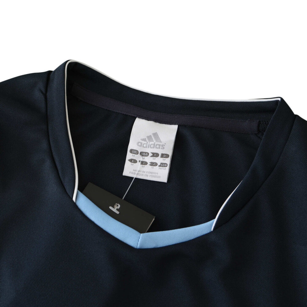 Real Madrid Retro Away 2003/04 Fan Version jersey, featuring a close-up of the collar and Adidas tag.
